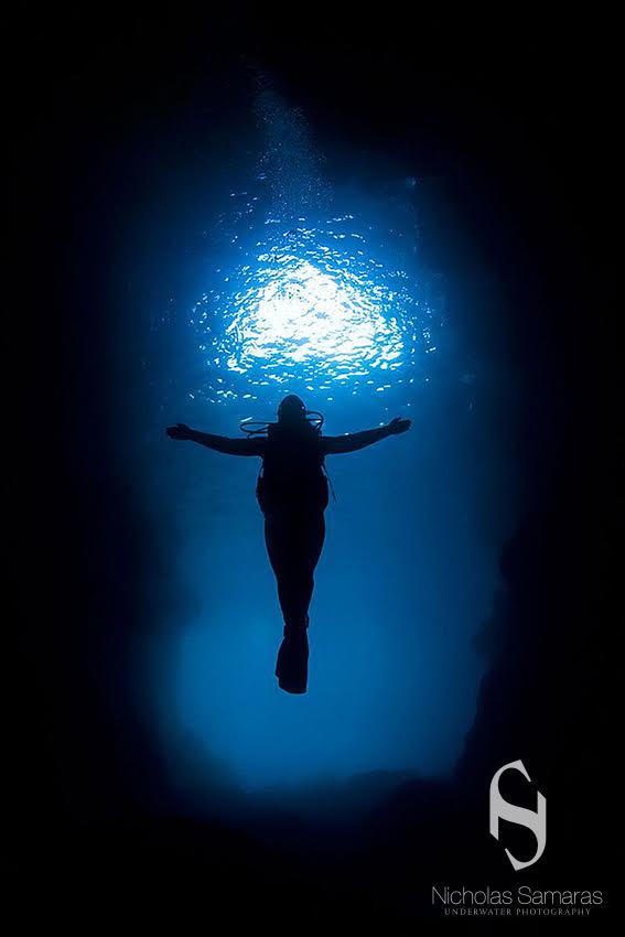 "At that time I had been visiting a diving centre in Sithonia, Chalkidiki to spend my summer vacation, and during a cave dive my model moved to the entrance of the cave and posed like the "Christ the Redeemer" statue in Rio de Janeiro, Brazil – a pose we’d been discussing some time before. The timing was amazing!" © Nicholas Samaras